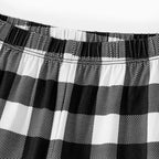 "2025 Family Christmas" Text and Christmas Pattern Black and White Plaid Family Matching Pajamas
