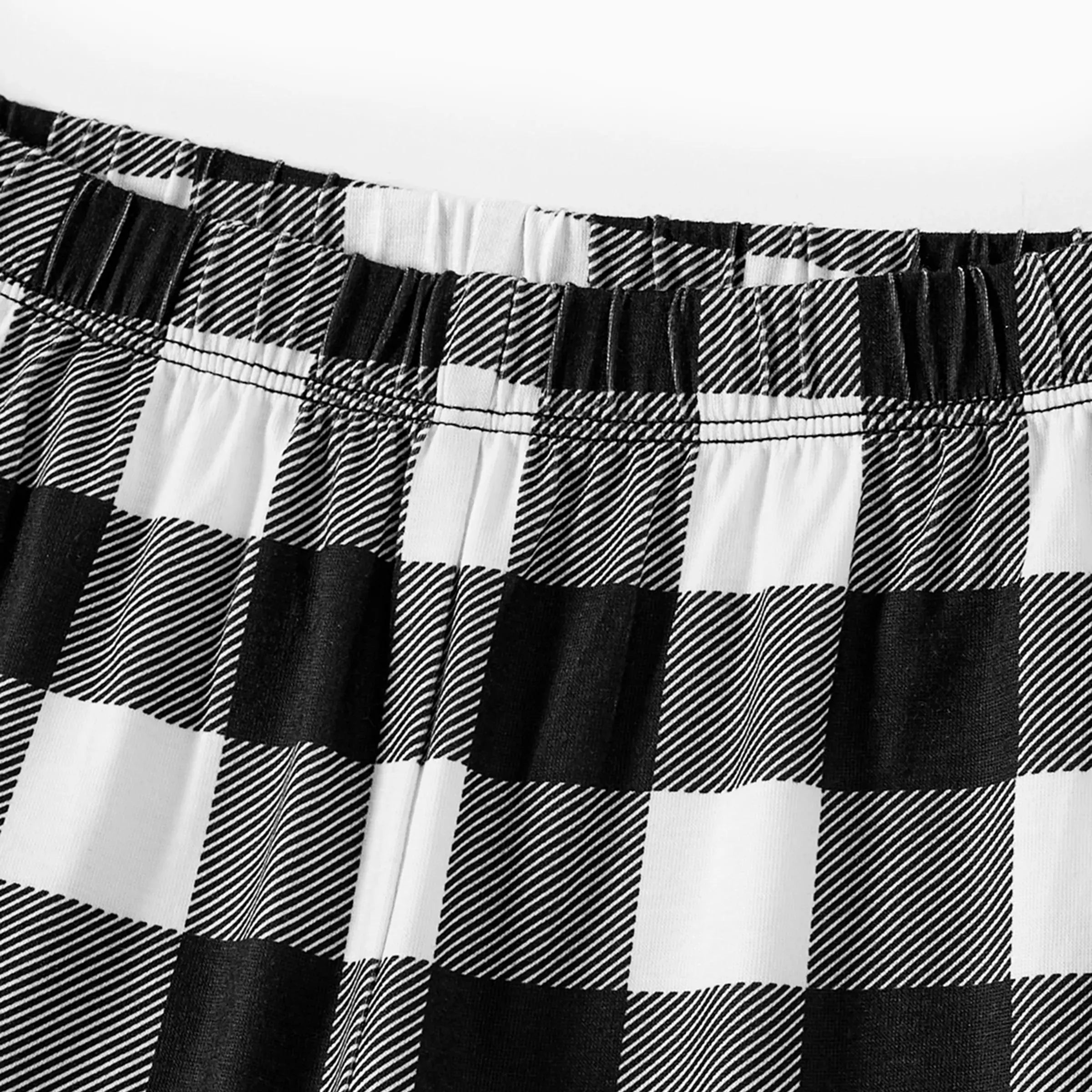 "2025 Family Christmas" Text and Christmas Pattern Black and White Plaid Family Matching Pajamas