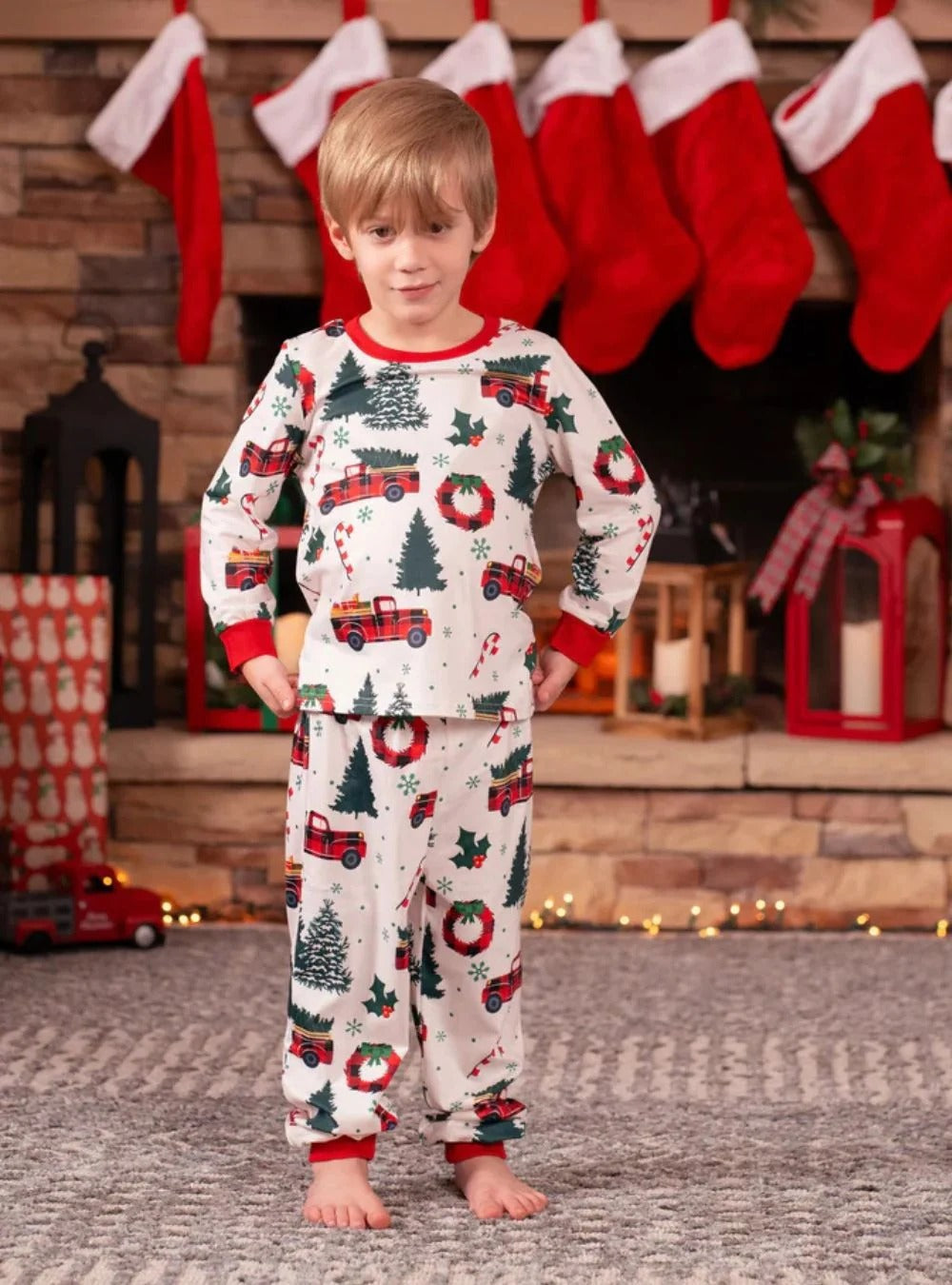 Superb white pajamas with Christmas trees red trucks motifs for all the family
