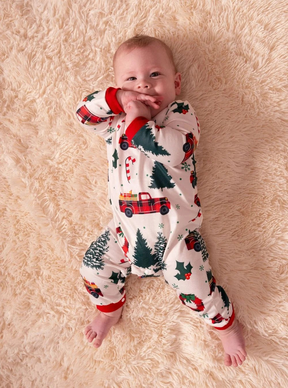 Superb white pajamas with Christmas trees red trucks motifs for all the family